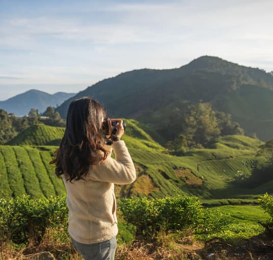 Tourist capturing images in Munnar