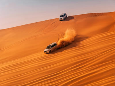 Dune bashing in the admirable golden hues of Abu Dhabi desert.