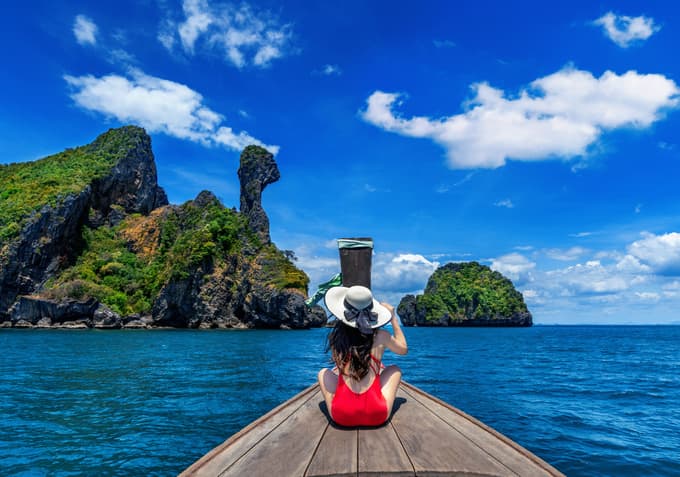 Sail to Chicken Island, known for its turquoise waters and white beaches