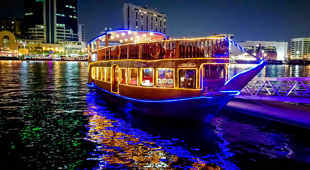 See the Dubai Creek from a different perspective on a traditional Dhow Cruise