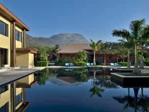 Take a relaxing dip inside the pool with a beautiful backdrop of Nandi hills