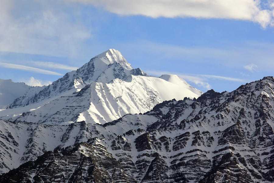 Marvel at the magnificent snow-capped mountains peaks during the Stok Kangri Trek