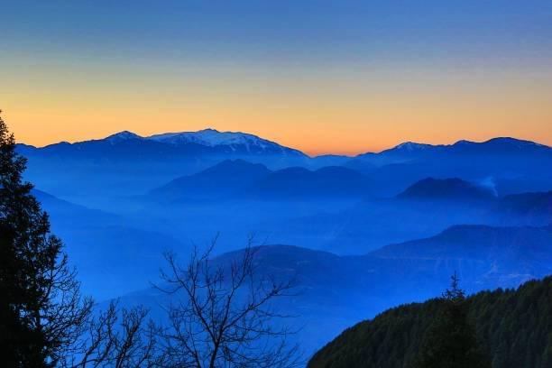 Capture Sunset over Snowy Peaks