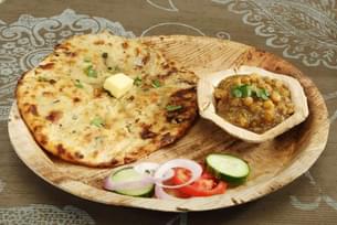 Relish the smoky, fluffy tandoori naan, straight from the tandoor