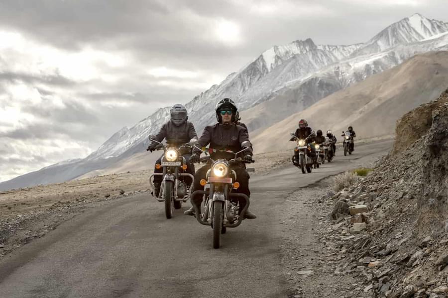 Cherish the breathtaking views of snow-capped mountains, deep valleys, and sparkling lakes on a Ladakh bike tour.
