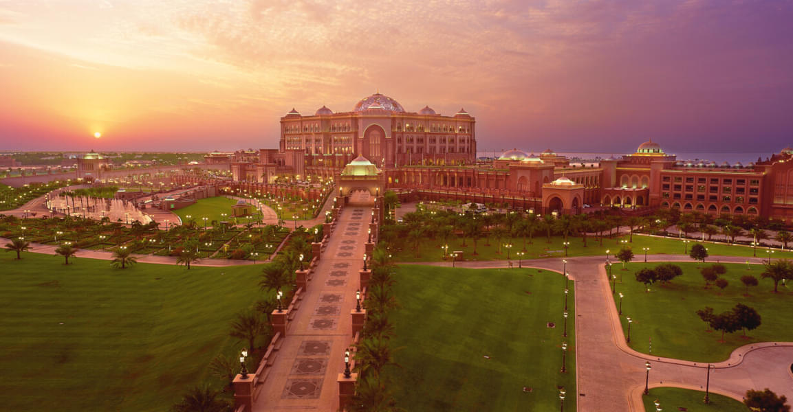Marvel at the breathtaking sunset view of the Emirates Palace, where the sky and the palace converge in a breathtaking display of beauty