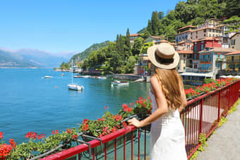 Tourist admiring the pristine blue waters of Lake Como, Zurich