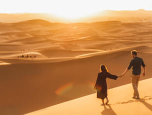 Tourist enjoying desert walk, Dubai