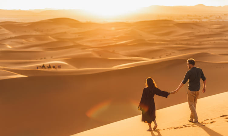 Tourist enjoying desert walk, Dubai