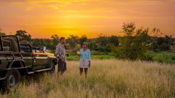 Couples enjoying sunset view of Kruger National Park, South Africa