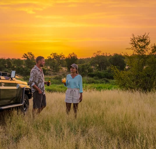 Couples enjoying sunset view of Kruger National Park, South Africa