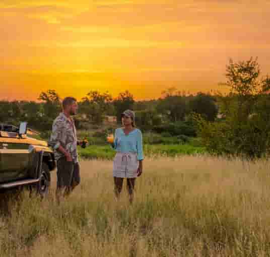 Couples enjoying sunset view of Kruger National Park, South Africa