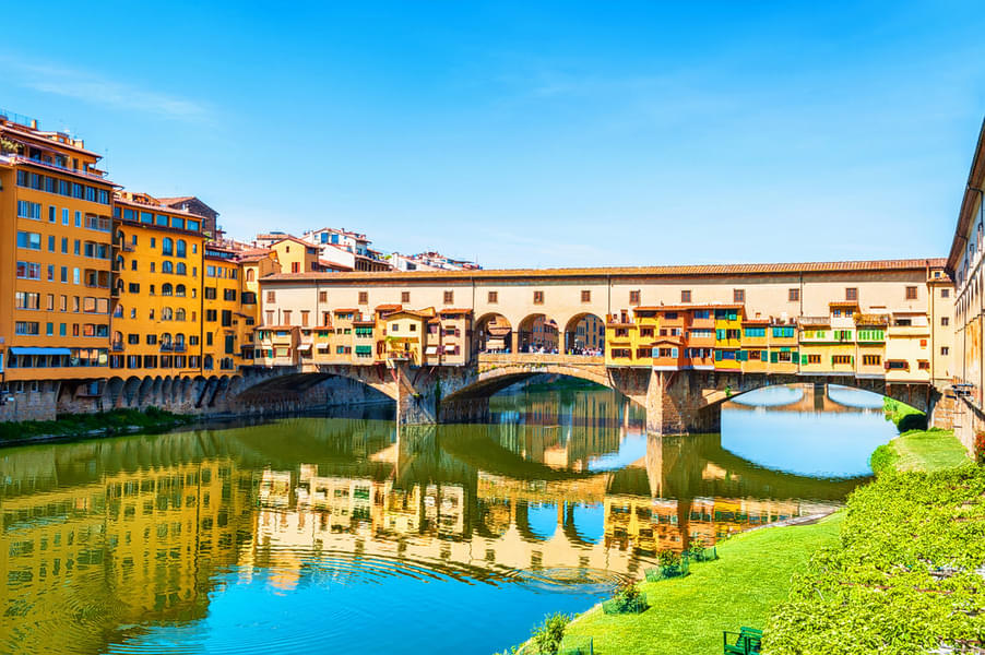 View the beautiful structure of Ponte Vecchio, an arched bridge 