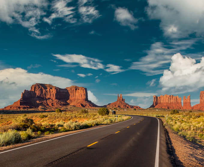 Witness Monument Valley’s sandstone giants rising from sacred Navajo desert lands