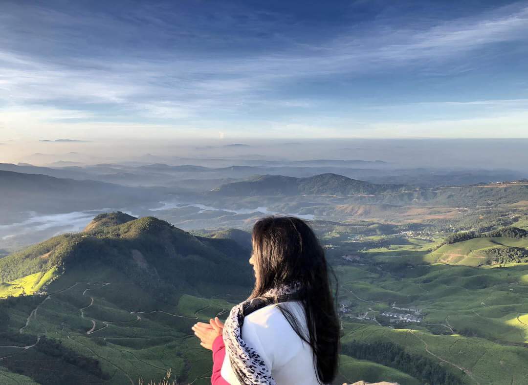 Embark on the Kolukkumalai Tea Estate Trek, starting with an overnight journey from Bangalore