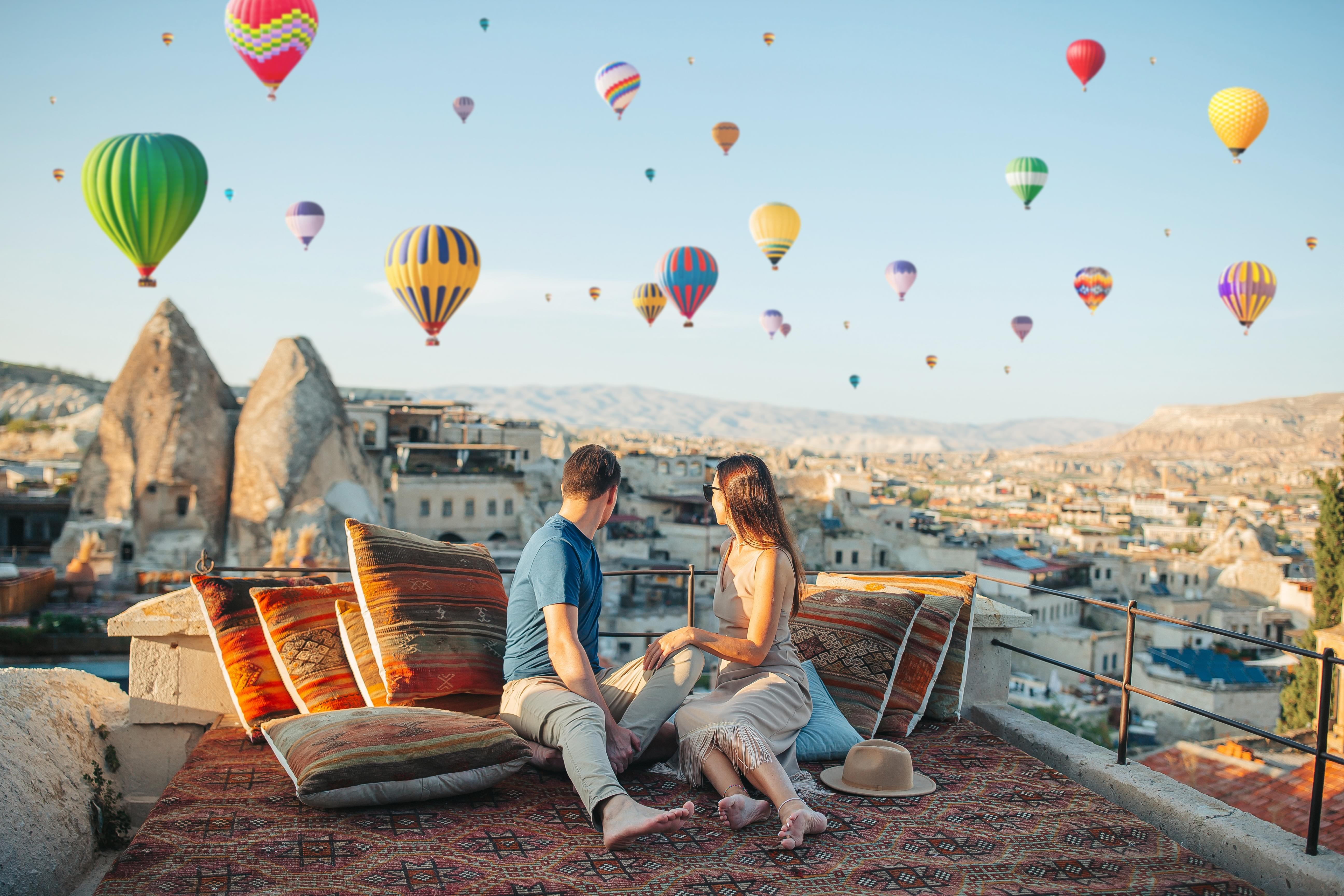 Hot air balloons soaring over the picturesque landscape of Cappadocia