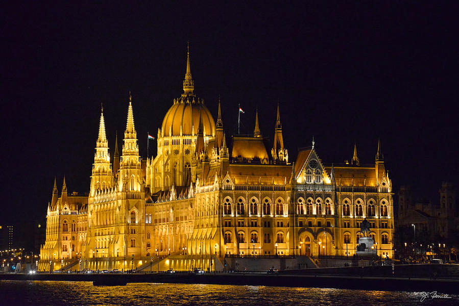 Pass by notable sites like the Hungarian Parliament