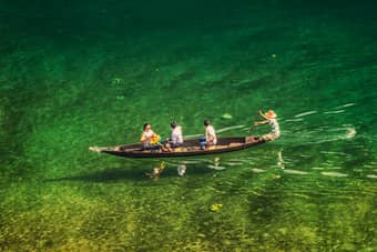 Tourists enjoying a boat ride in Dawki