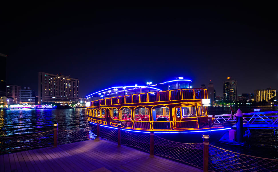 Experience the tranquility and serenity of Dubai Creek during a captivating Dhow Cruise journey