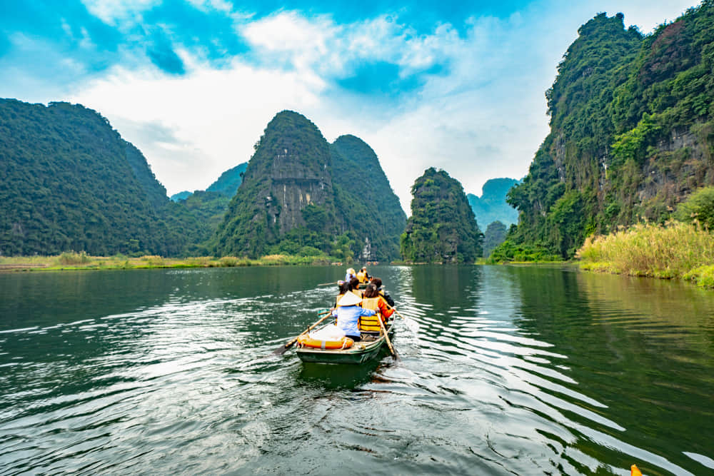Boating for cave tours in Trang An