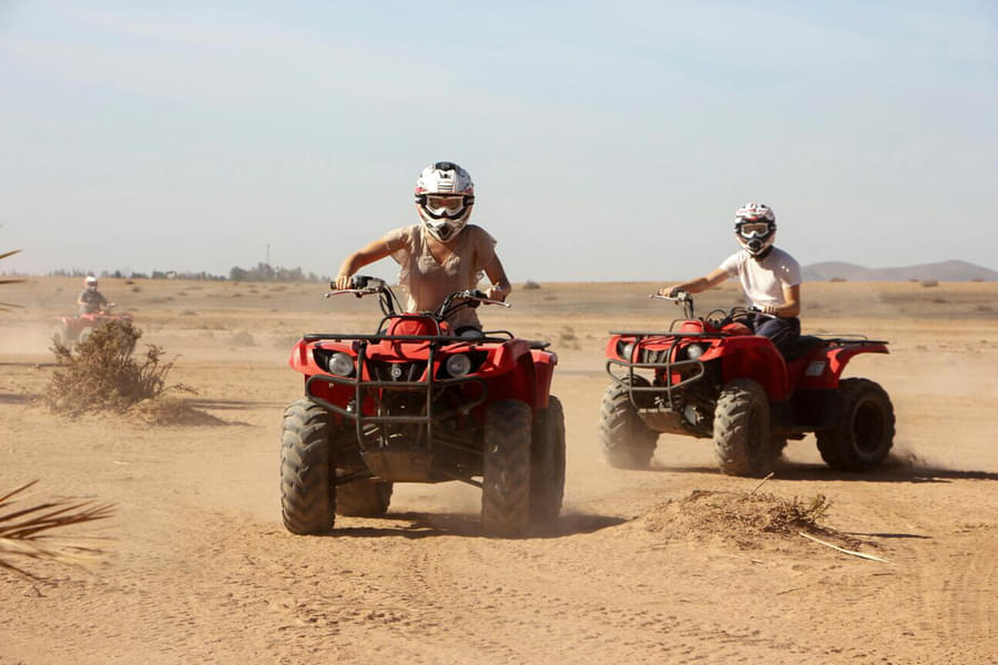 Gear up for a thrilling dune bashing session on a quad bike