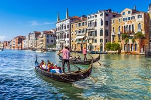 Tourist enjoying Gondola ride in Venice