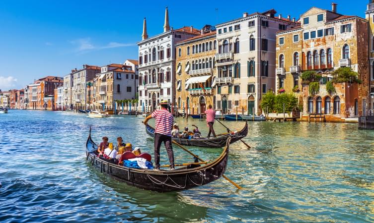 Tourist enjoying Gondola ride in Venice