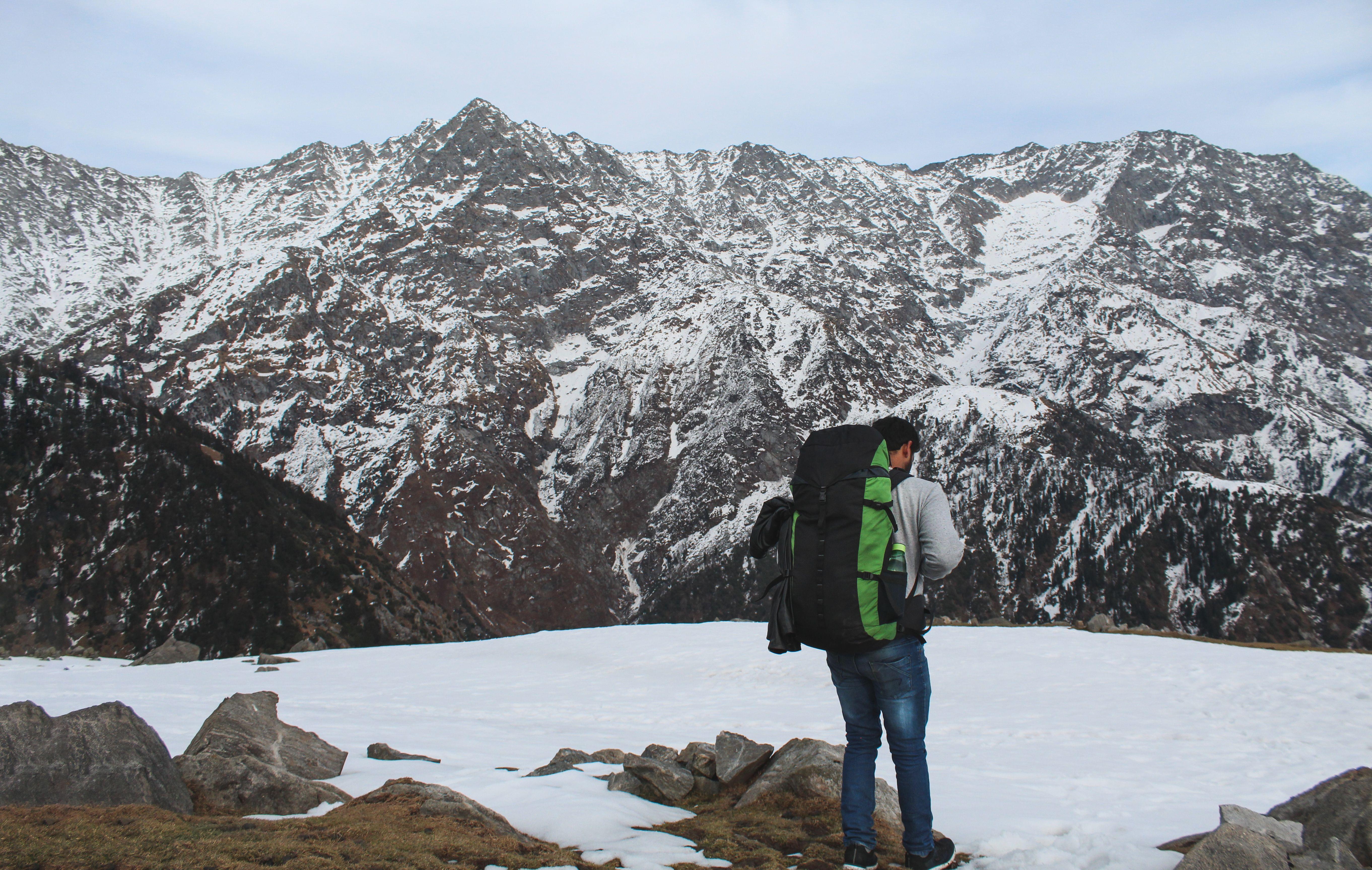 A young man trekking across the Himalayan region of Triund