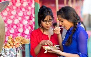 Tourist enjoying street food in Jaipur