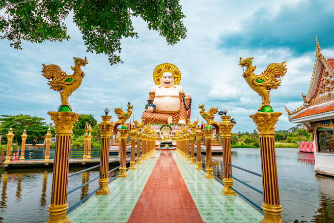 Wat Plai Laem Buddhism Temple statues during a bright sunny day in Koh Samu