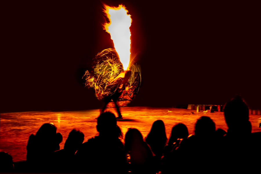 Get stunned by the amazing fire dance performed by the professionals