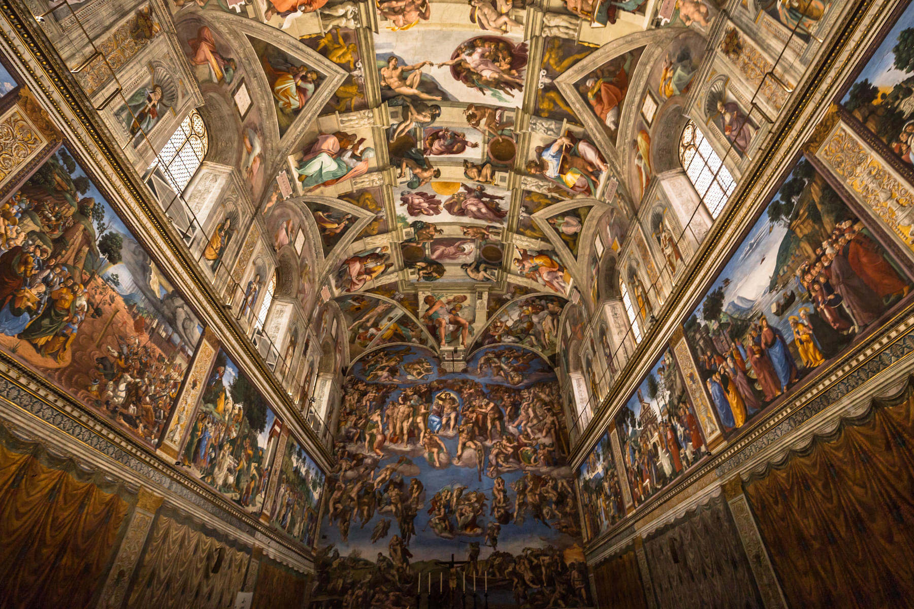 Admire Michelangelo's frescoes of across the ceiling & walls of the Sistine Chapel