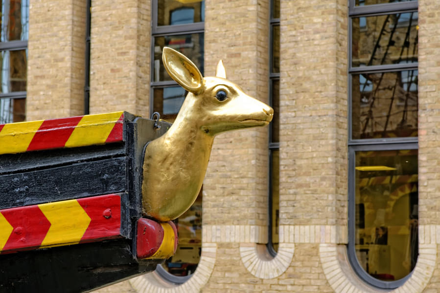 Marvel at the gleaming golden deer on the ship's front 