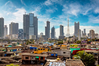 Marvel at Dharavi’s contrast of slums against Mumbai’s skyscrapers