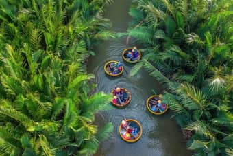 Tourists enjoying on the basket boats in Hoi An