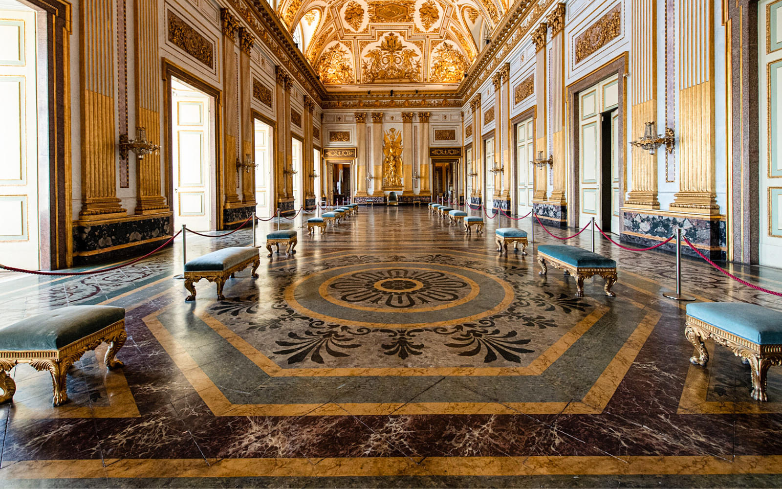 Admire the stunning Baroque architecture and furniture in the rooms of the palace