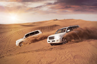 Hold on tight for an exhilarating ride through Dubai desert's golden sand dunes 