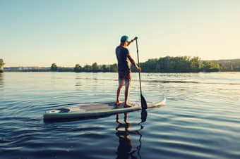 Stand-up paddleboarding, an adventure perfect for both beginners and seasoned paddlers