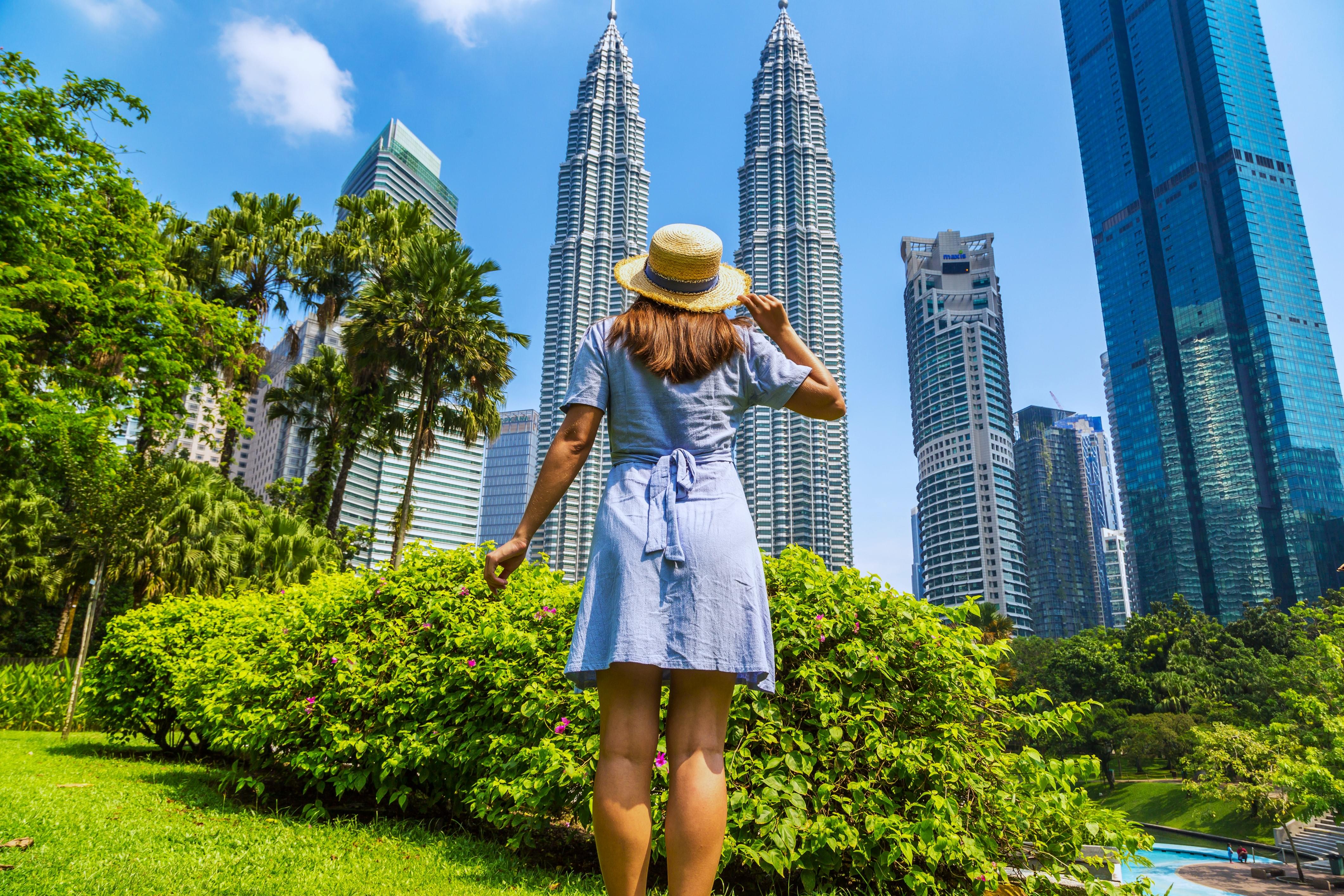 Tourist enjoying the view of Kuala Lumpur skyscrapers