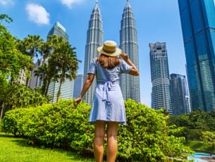 Tourist enjoying the view of Kuala Lumpur skyscrapers