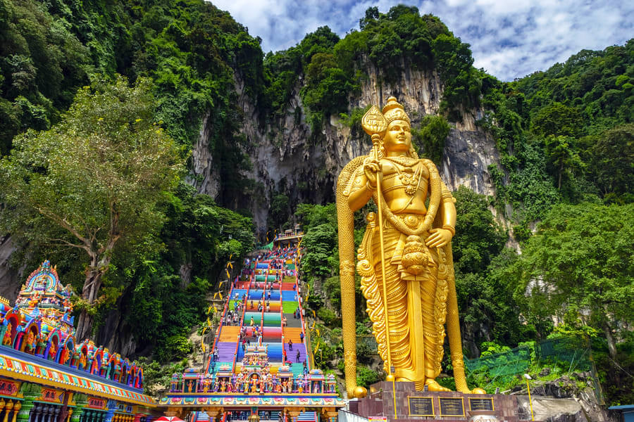 Get fascinated by the stunning statue of Lord Murugan at the Batu Caves