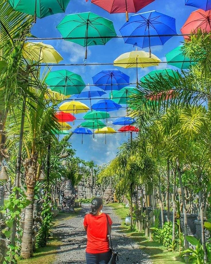 Walk under colourful umbrellas