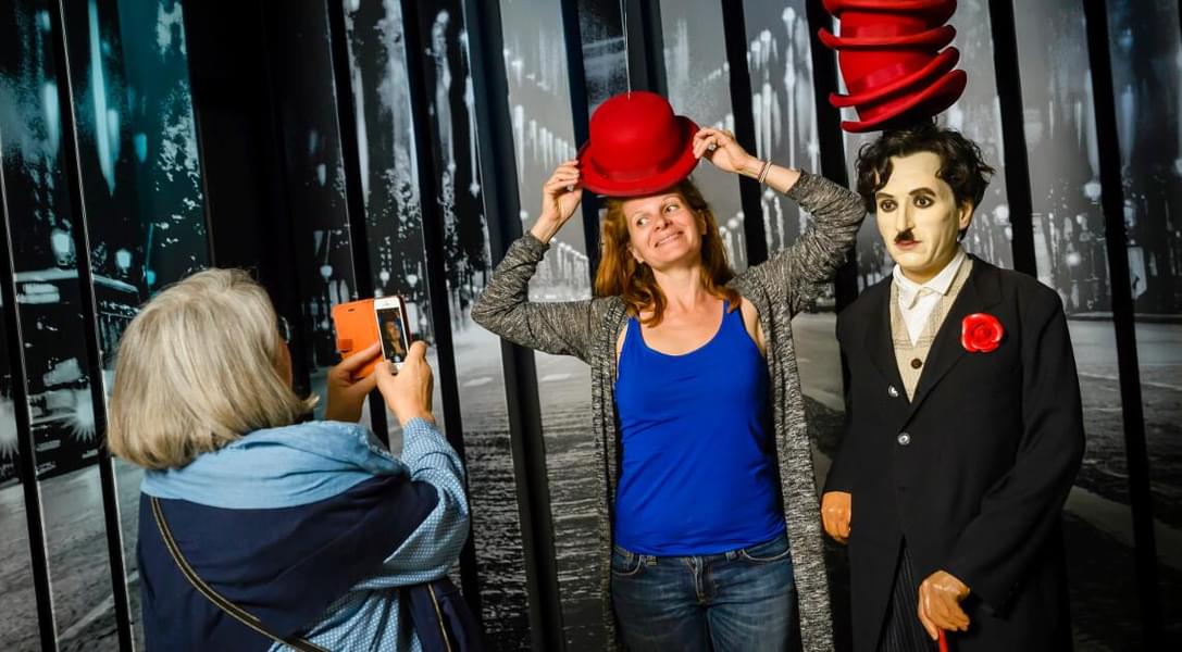 Click pictures with the wax replica of Charlie Chaplin