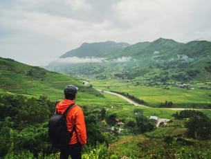 Tourists admiring the lush green landscape of Ranikhet