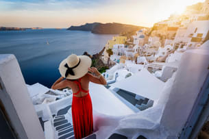Woman admiring the view of Santorini