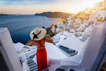 Woman admiring the view of Santorini