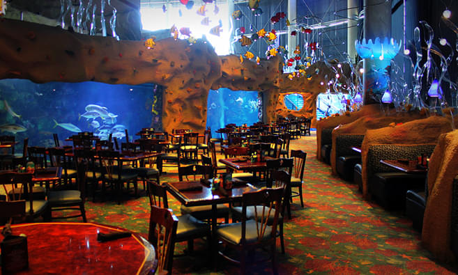 Enjoy dining at the complex near an aquarium filled with a million gallons of water