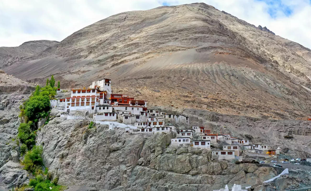 Get a chance to witness the ancient walls and prayer flags of Diskit Gompa which offer a glimpse into the rich artistic and spiritual traditions of Ladakh.