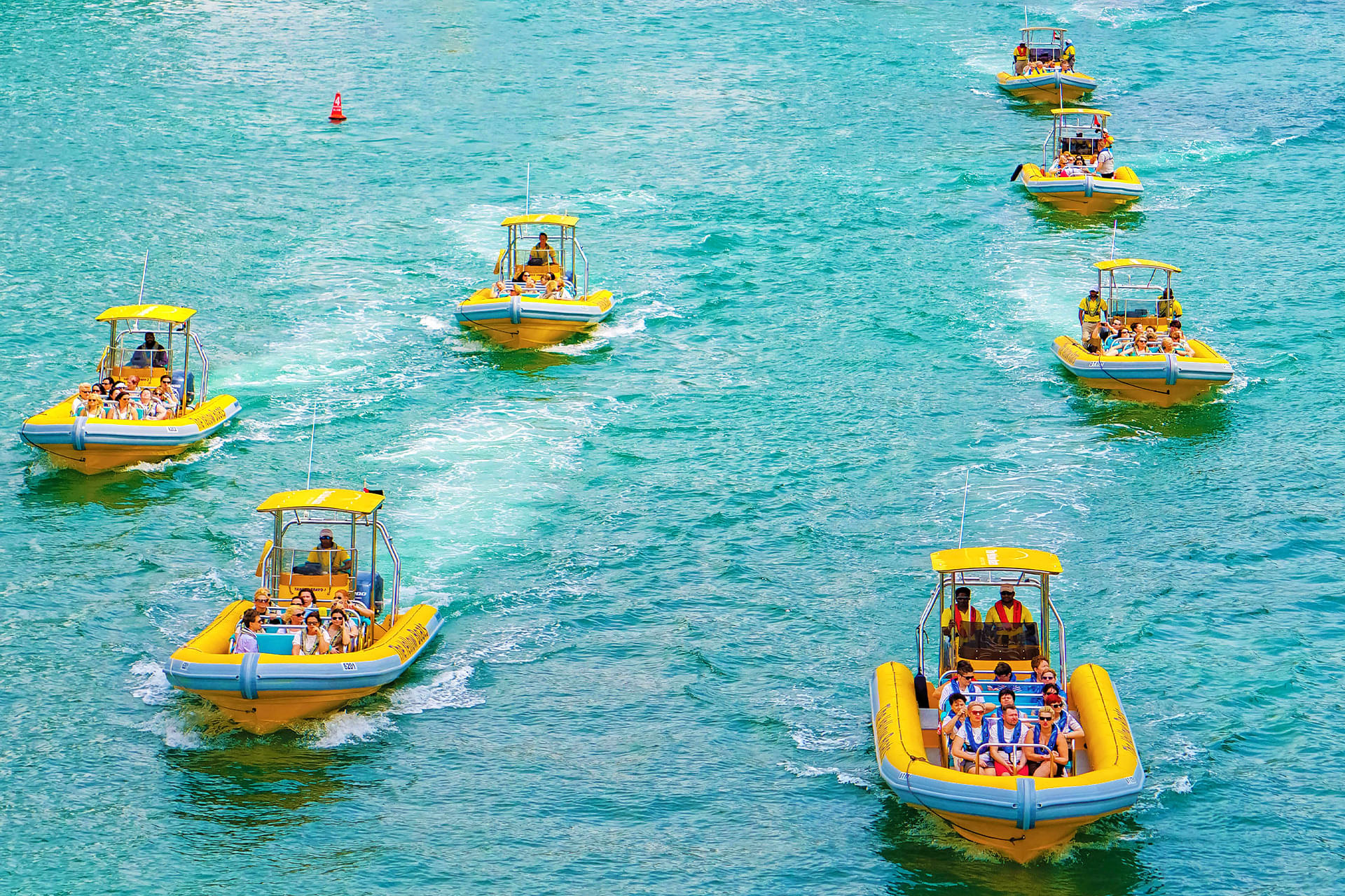People enjoying boat rides on Dubai's turquoise-blue waters