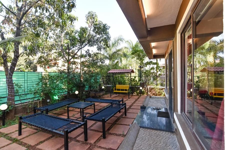 A Luxurious Villa Amidst Lush Gardens In Lonavala Image